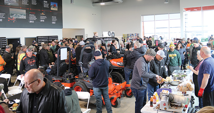 The packed dealership during the grand opening.<br />
